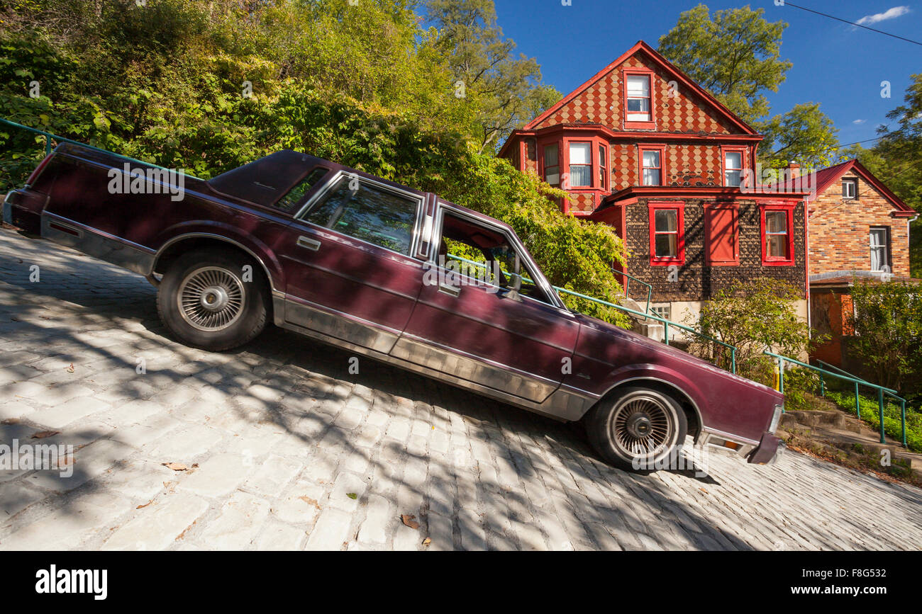 A car driving down Canton Avenue in the Beechview Neighbourhood of