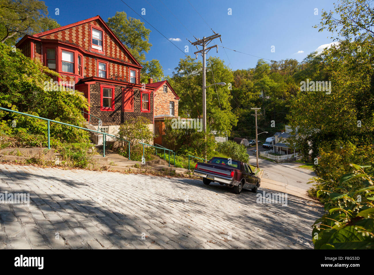 A car driving down Canton Avenue in the Beechview Neighbourhood of