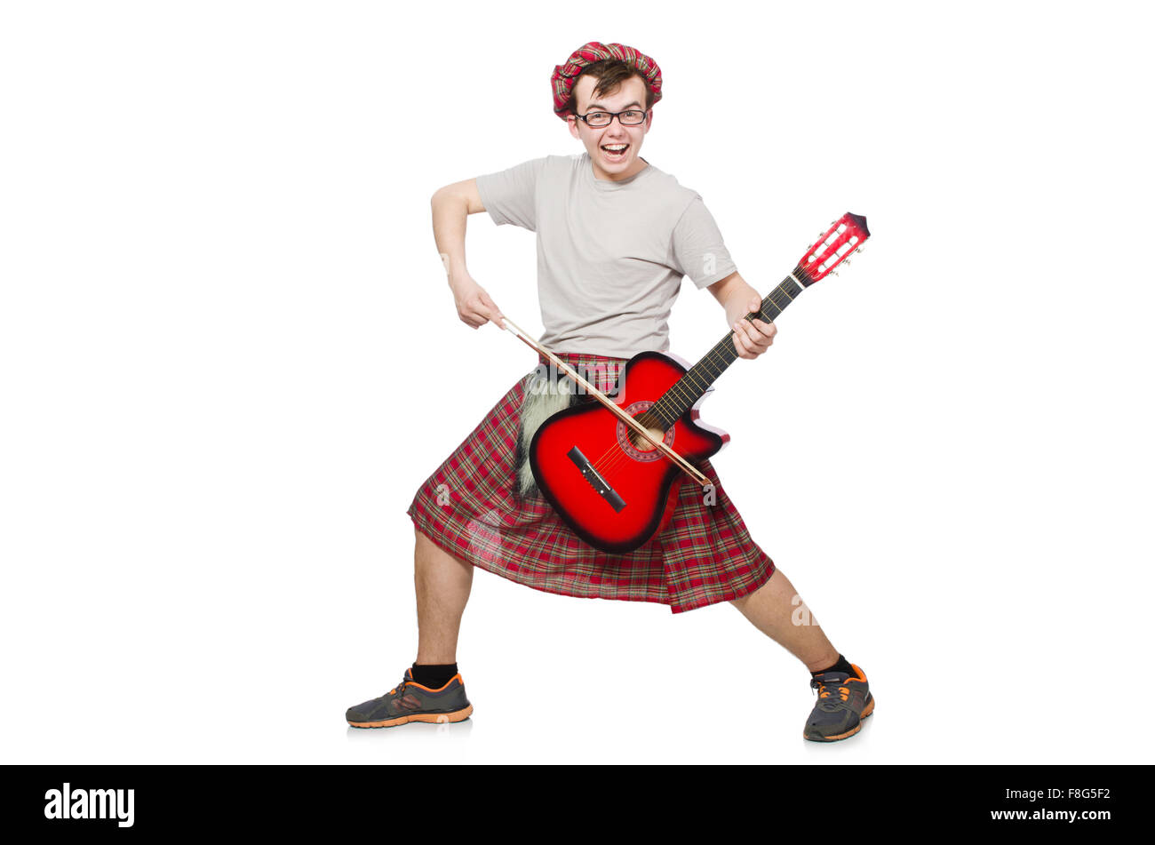 Funny scotsman with musical instrument isolated on white Stock Photo