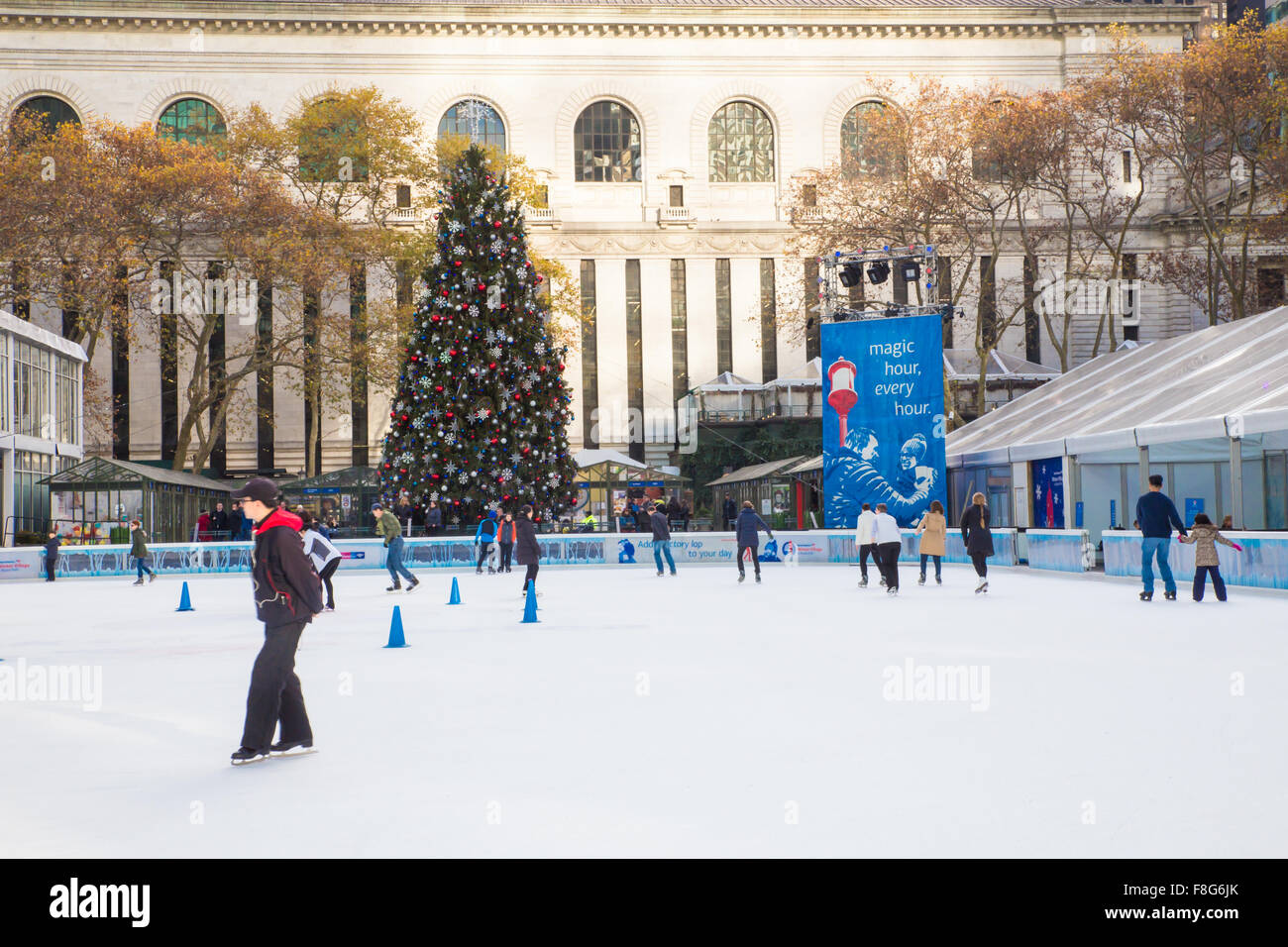 View of Citi Pond ice skating rink at Bryant Park in Manhattan with Christmas Tree on display Stock Photo