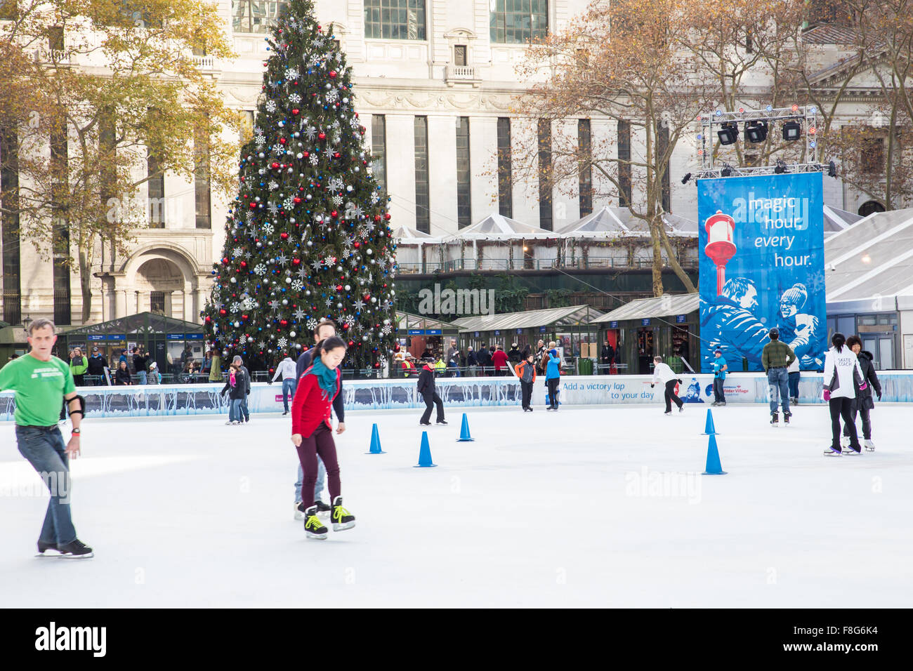 View of Citi Pond ice skating rink at Bryant Park in Manhattan with Christmas Tree on display Stock Photo