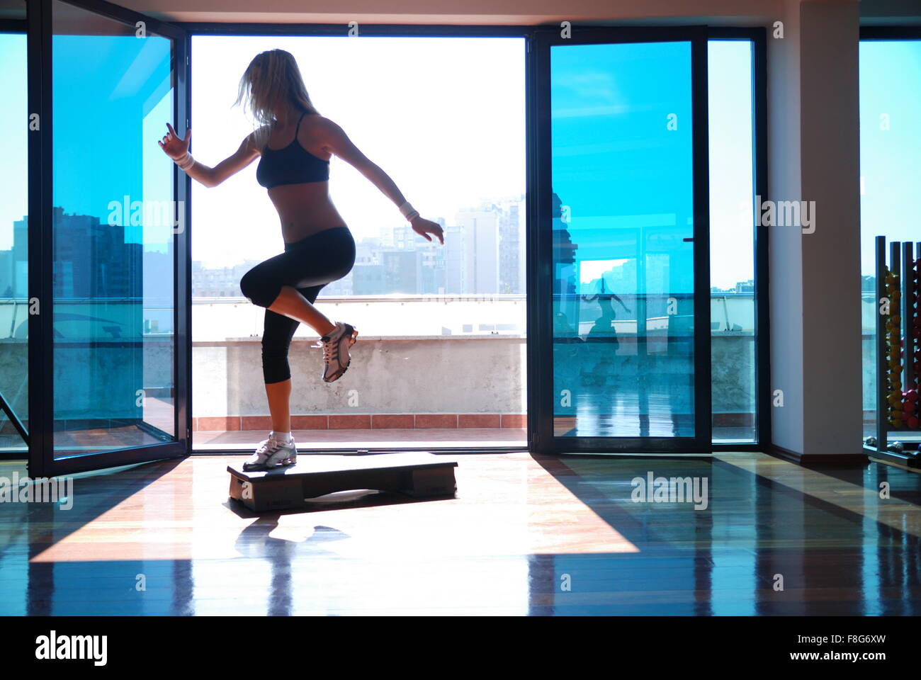Stepping In women stepping in a fitness center Stock Photo - Alamy
