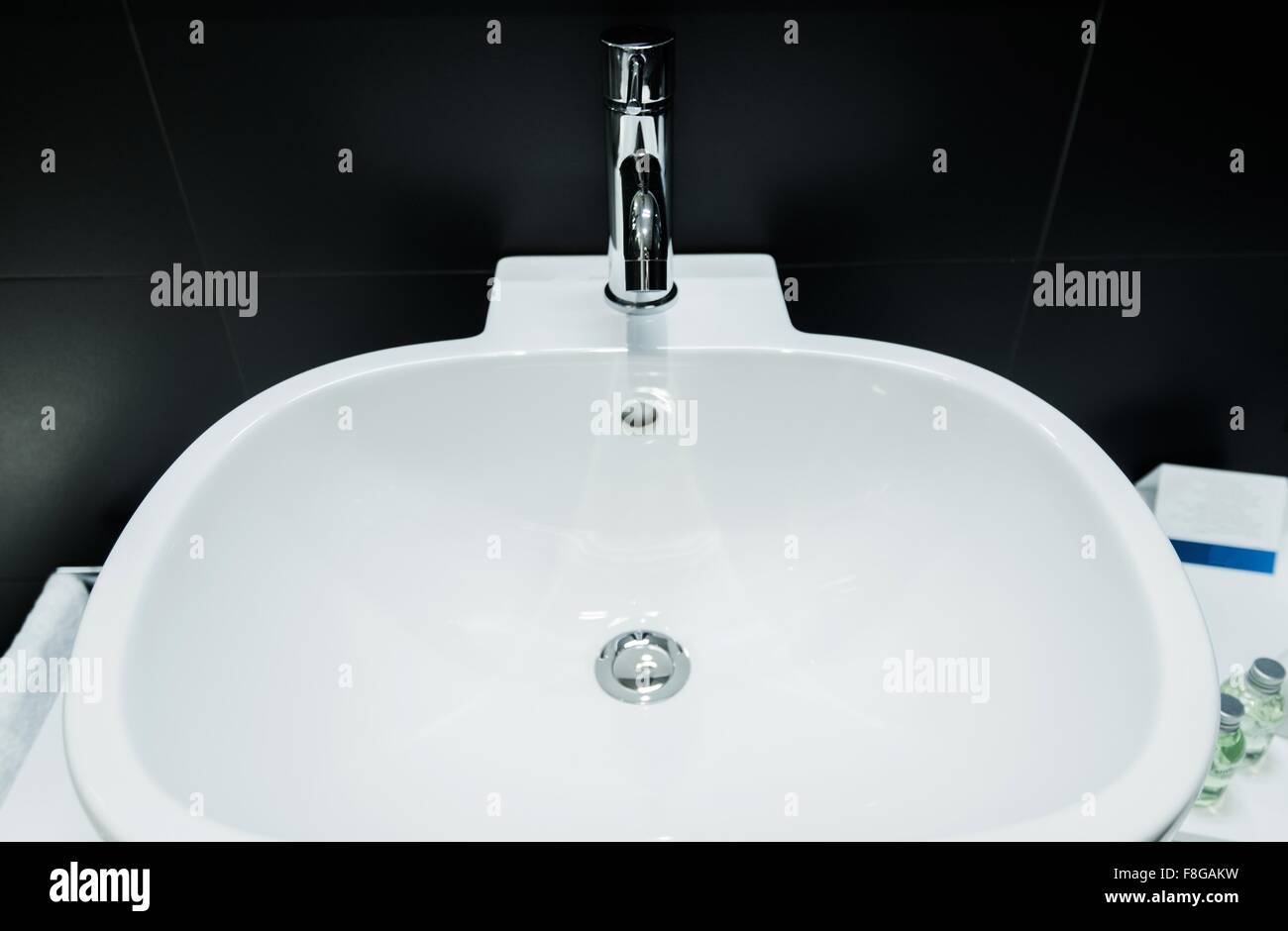Modern Bathroom Bowl Sinks and Black Tiles Bathroom Interior Design. Stock Photo