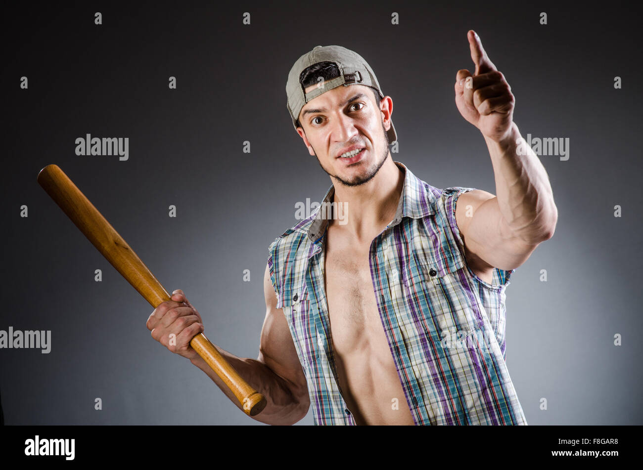 Violent man with baseball bat and hat Stock Photo Alamy
