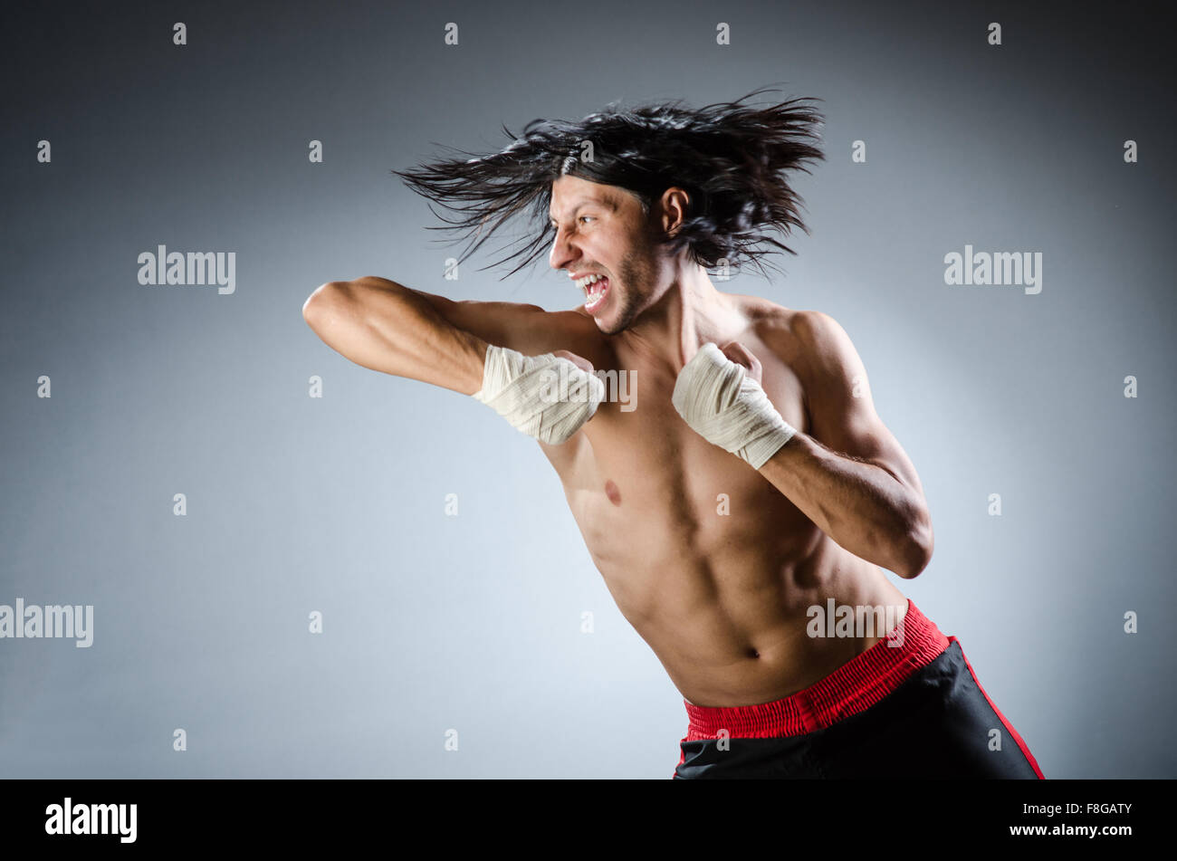 Aggressive Ripped Ripped martial arts expert at training Stock Photo - Alamy
