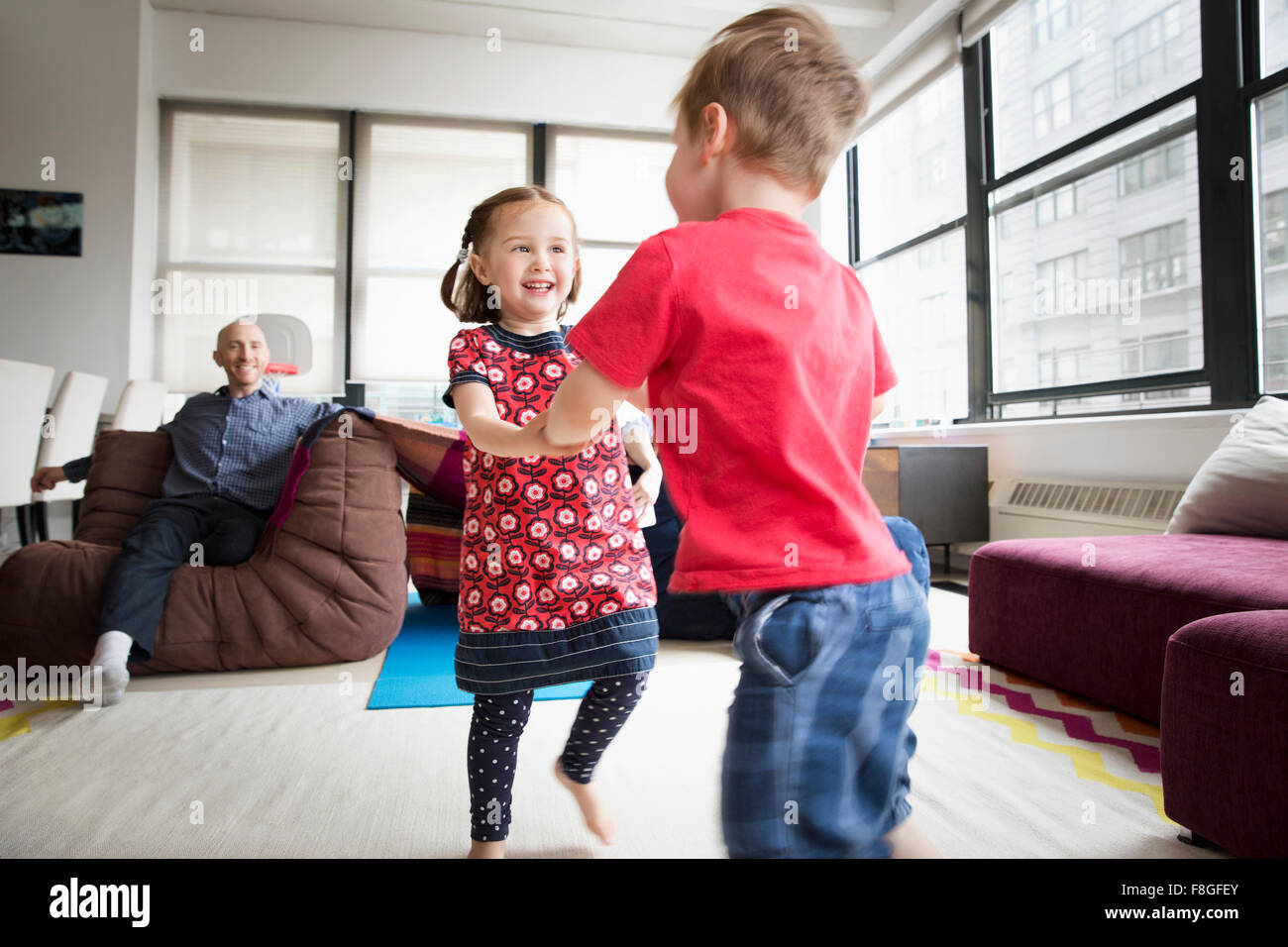 Children dancing in living room Stock Photo