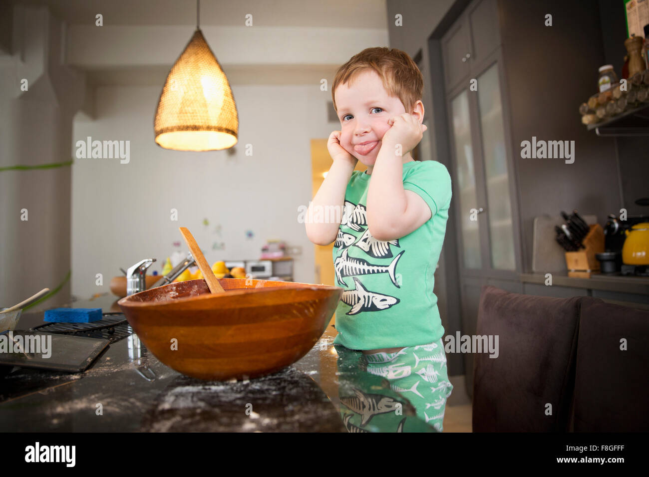 Boy cooking in kitchen Stock Photo Alamy
