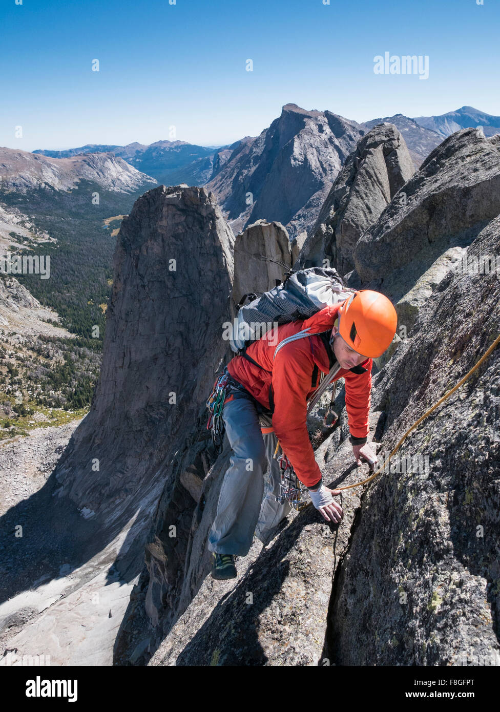 Caucasian climber on mountainside Stock Photo