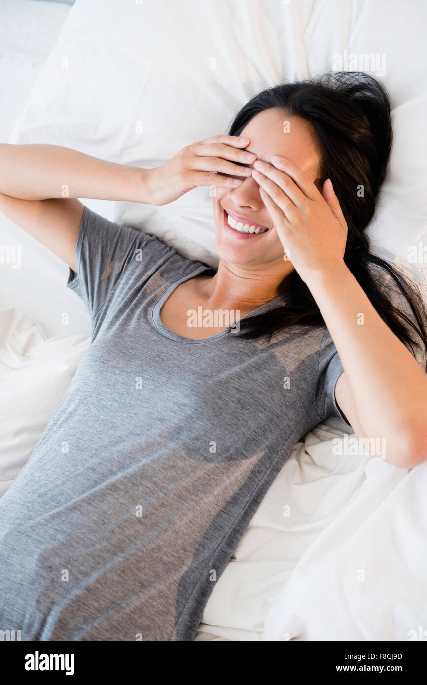 Chinese woman covering her eyes Stock Photo