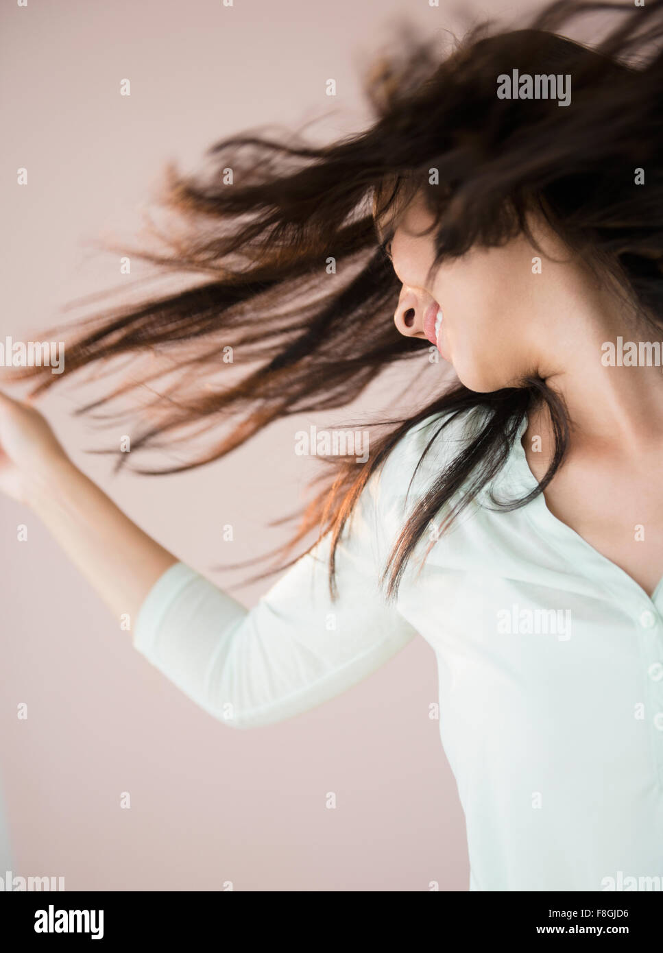 Chinese woman tossing her hair Stock Photo