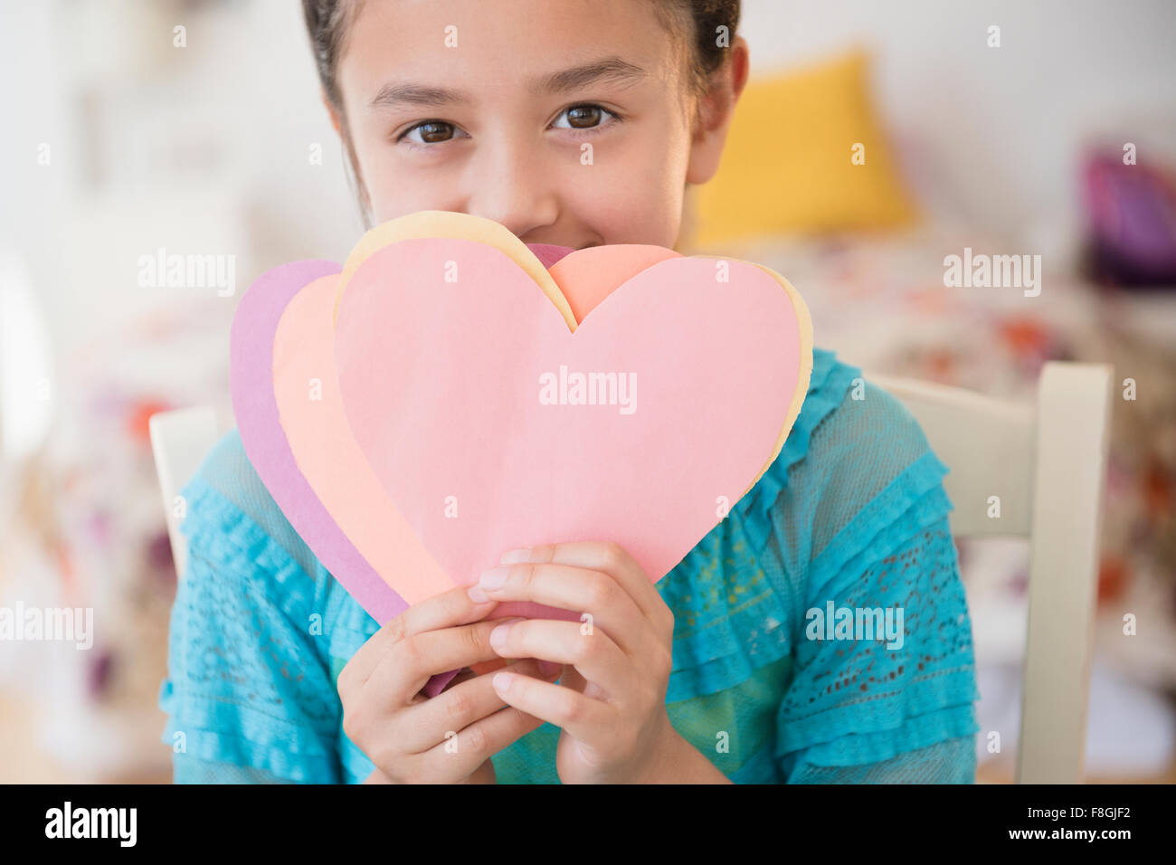 Girl holding paper hearts Stock Photo