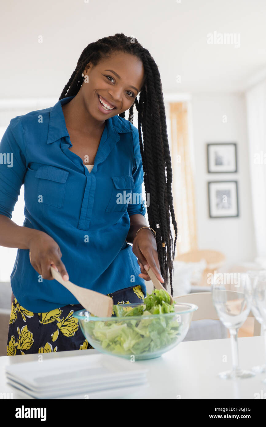Black woman tossing salad Stock Photo