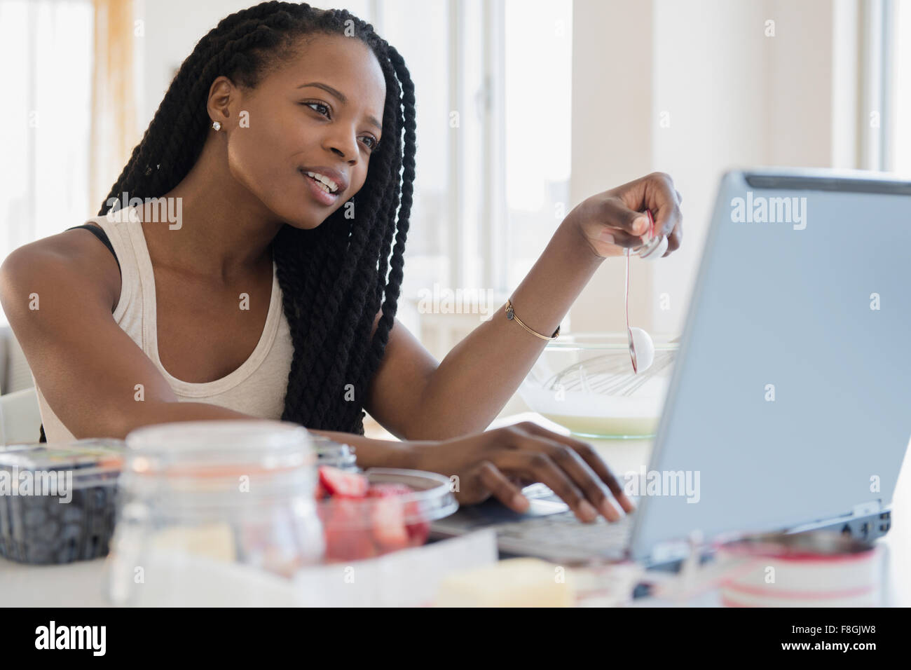 Black woman using laptop Stock Photo