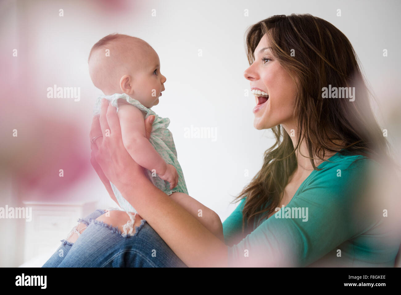 Mother holding baby daughter Stock Photo