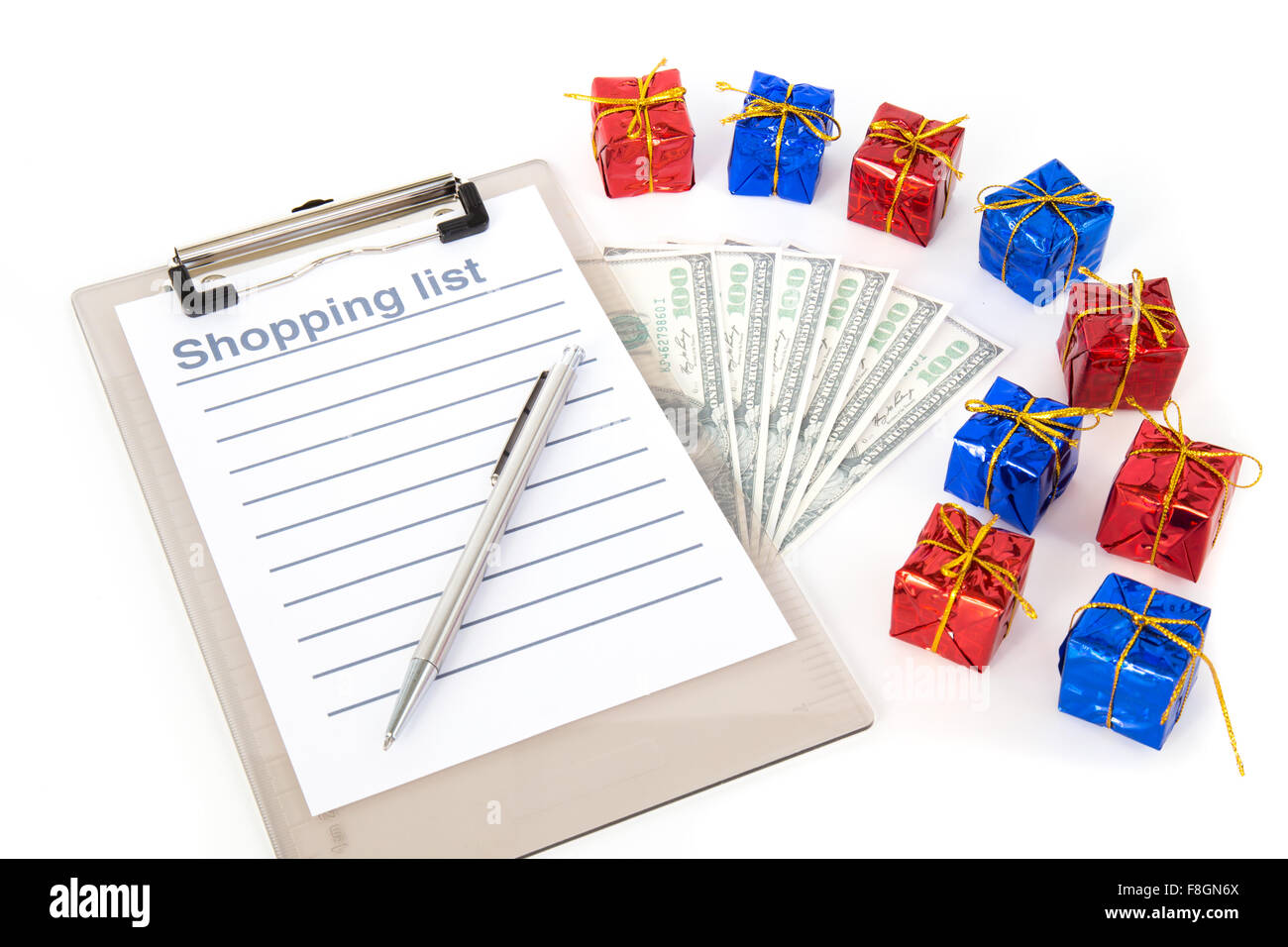 Christmas shopping list with dollar bills Stock Photo