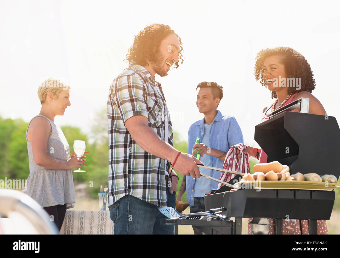 Friends talking at barbecue Stock Photo