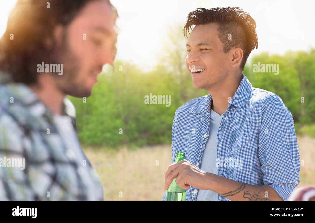 Man drinking beer outdoors Stock Photo