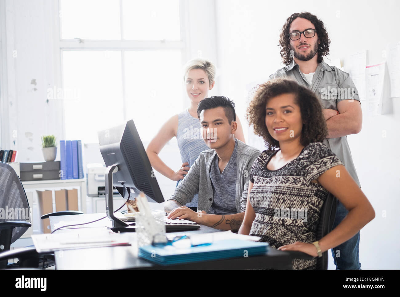 Business people smiling in office Stock Photo - Alamy