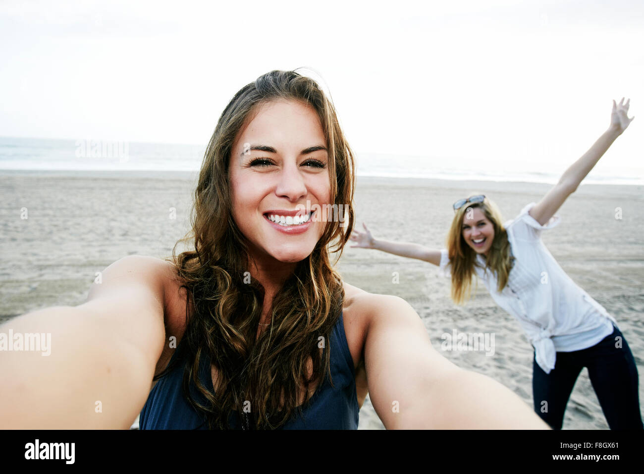 Women taking selfie on beach Stock Photo