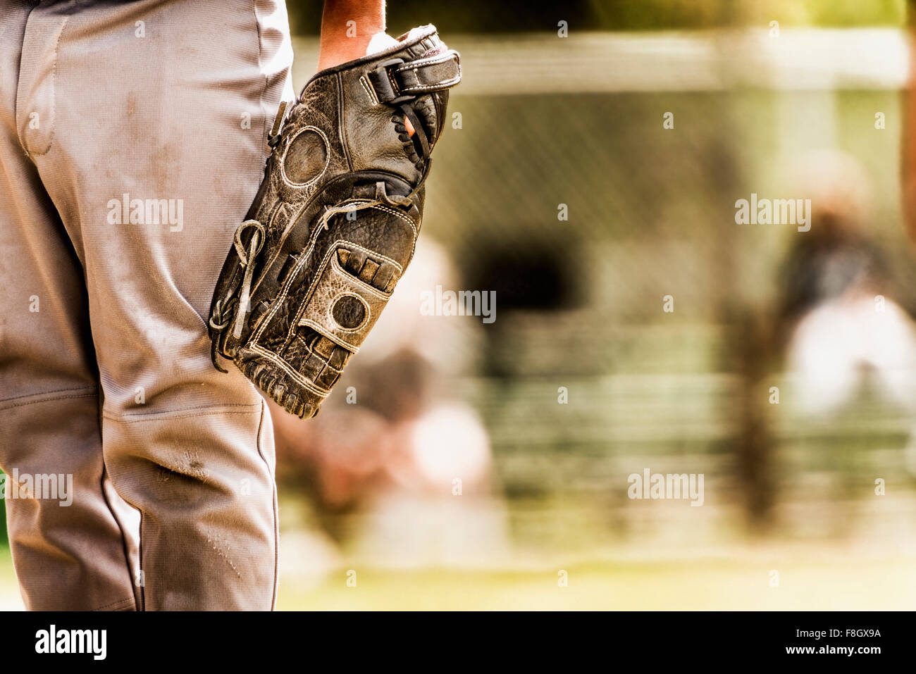 Baseball player wearing baseball glove Stock Photo