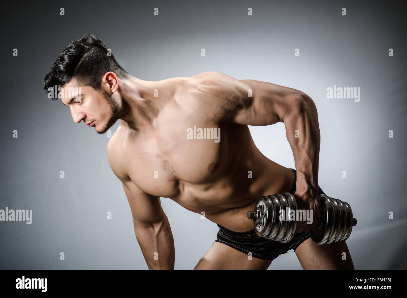 Bodybuilding Ripped Model Muscular ripped bodybuilder with dumbbells Stock Photo - Alamy