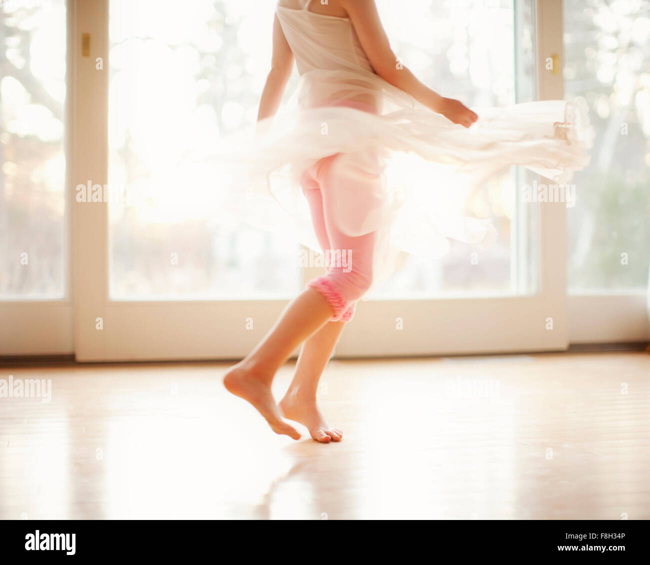 Girl twirling in skirt Stock Photo