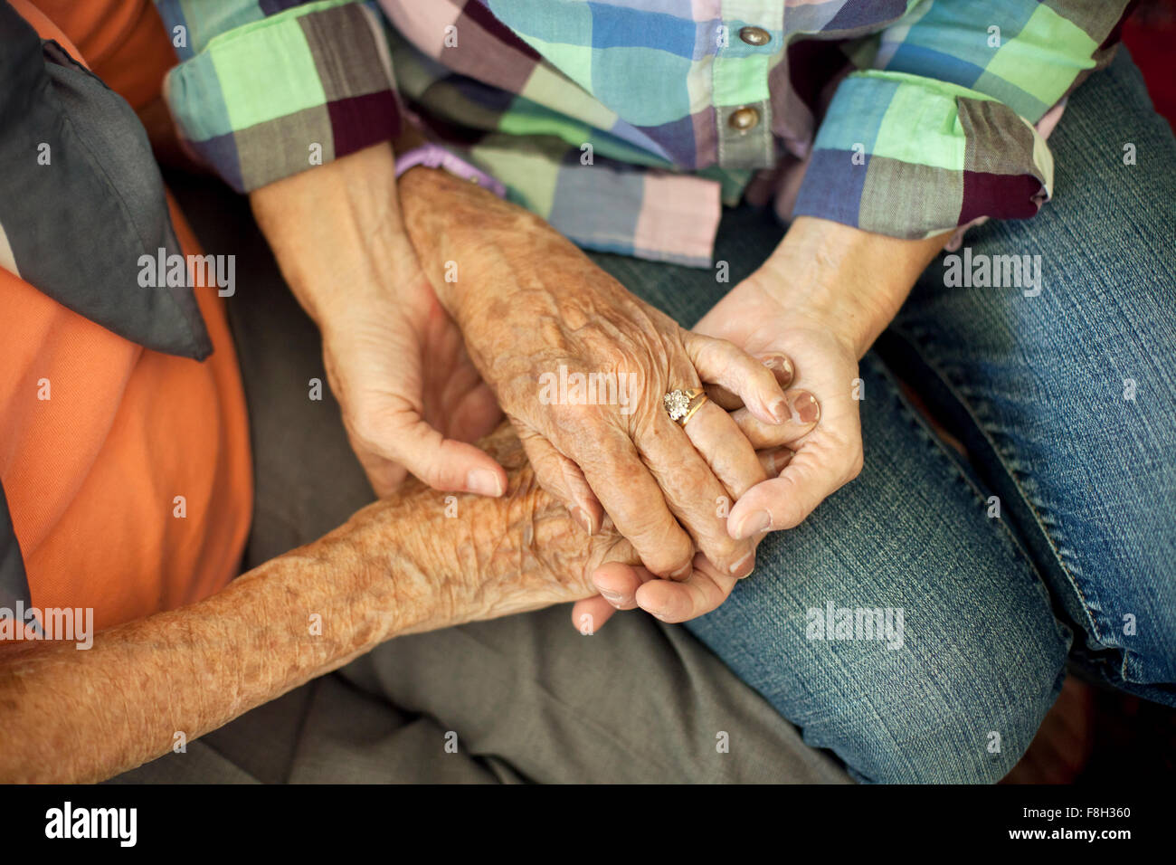 Mother and daughter holding hands Stock Photo