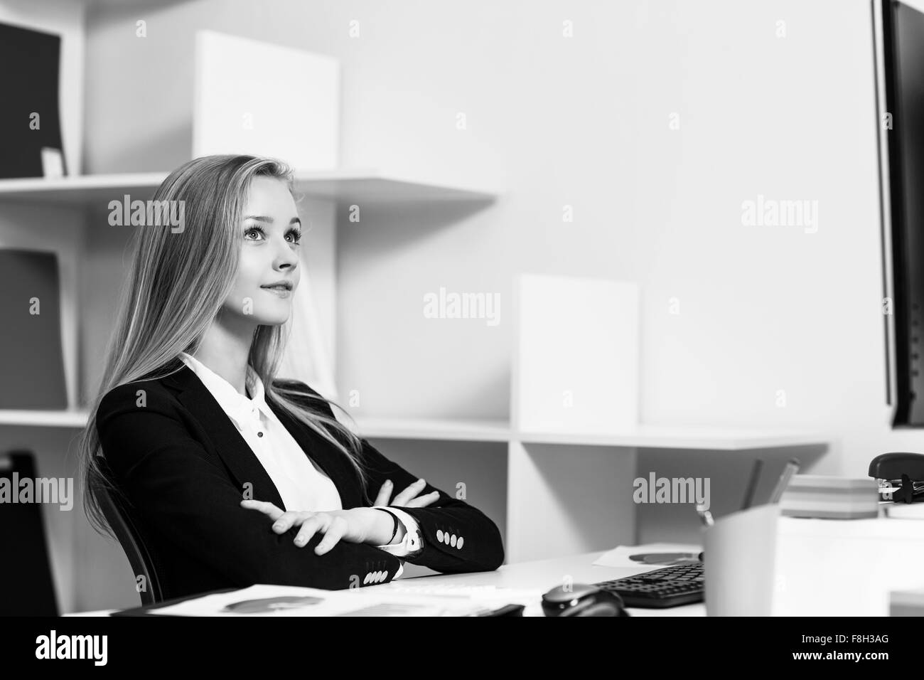 Woman sitting at the desk  with computer Stock Photo