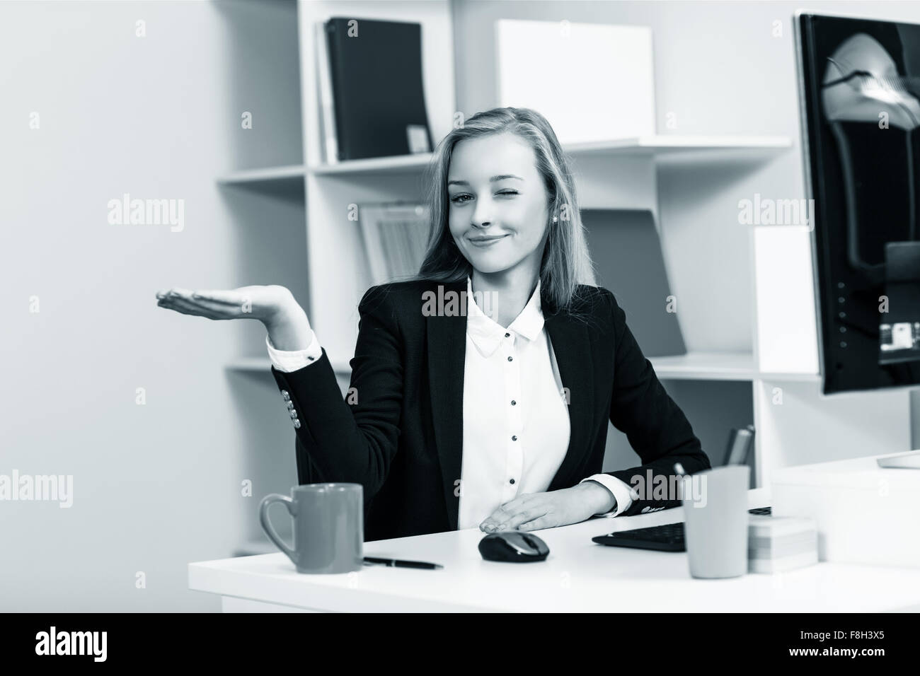 Woman sitting at the desk  with computer Stock Photo