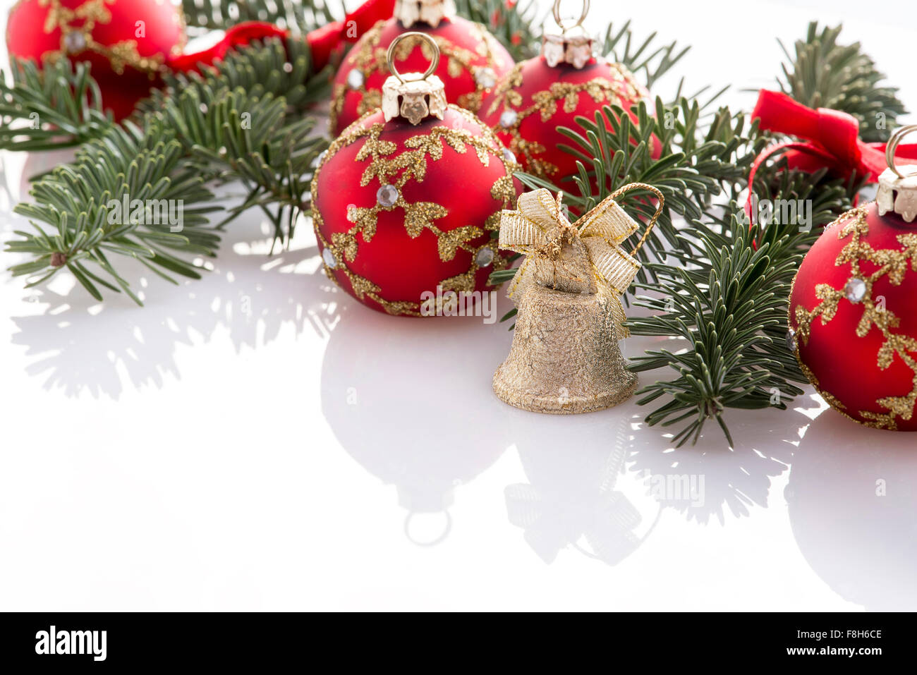 red christmas ball decorations and fir tree on white background Stock ...