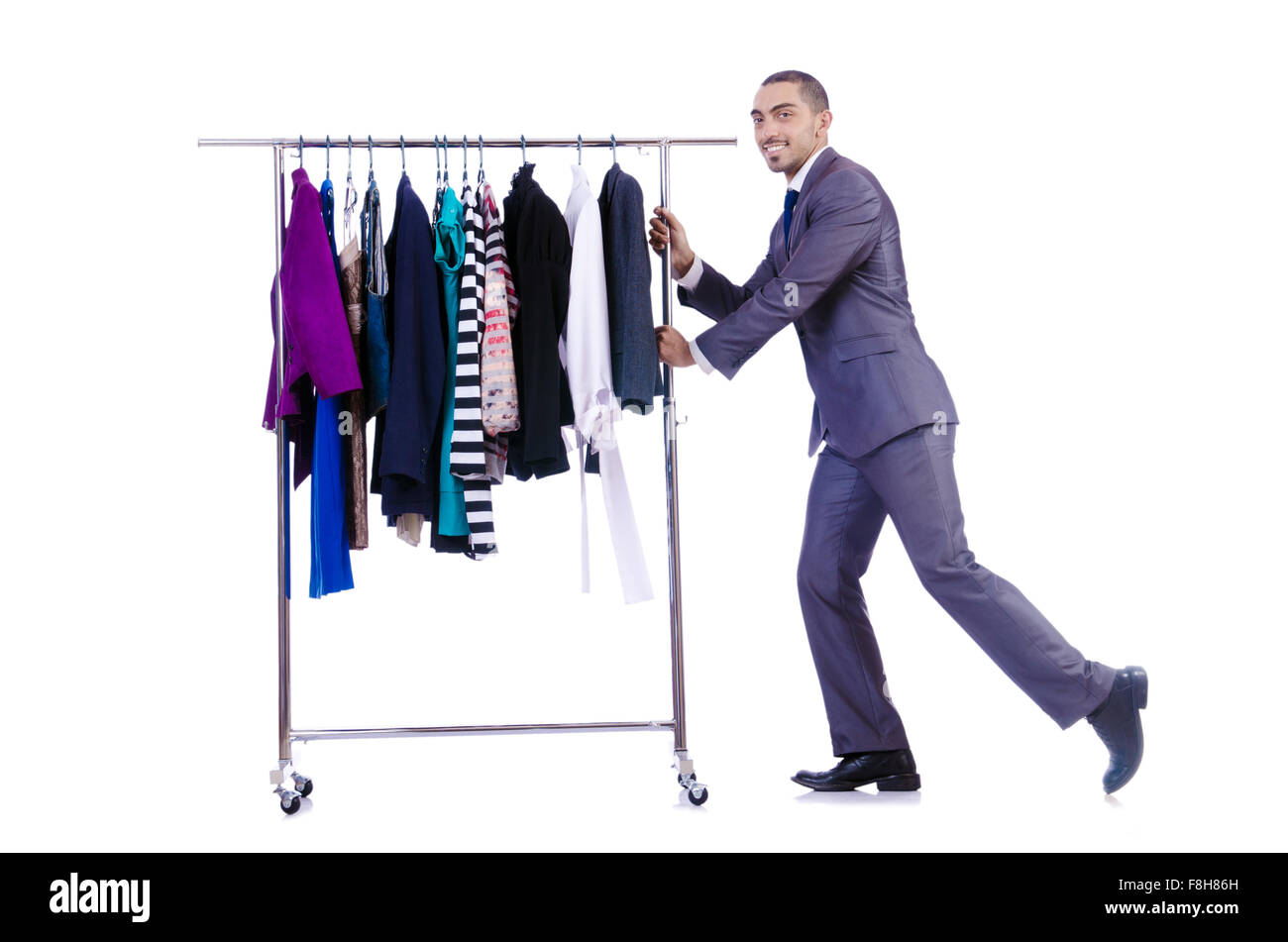 Businessman with rack of clothing Stock Photo - Alamy