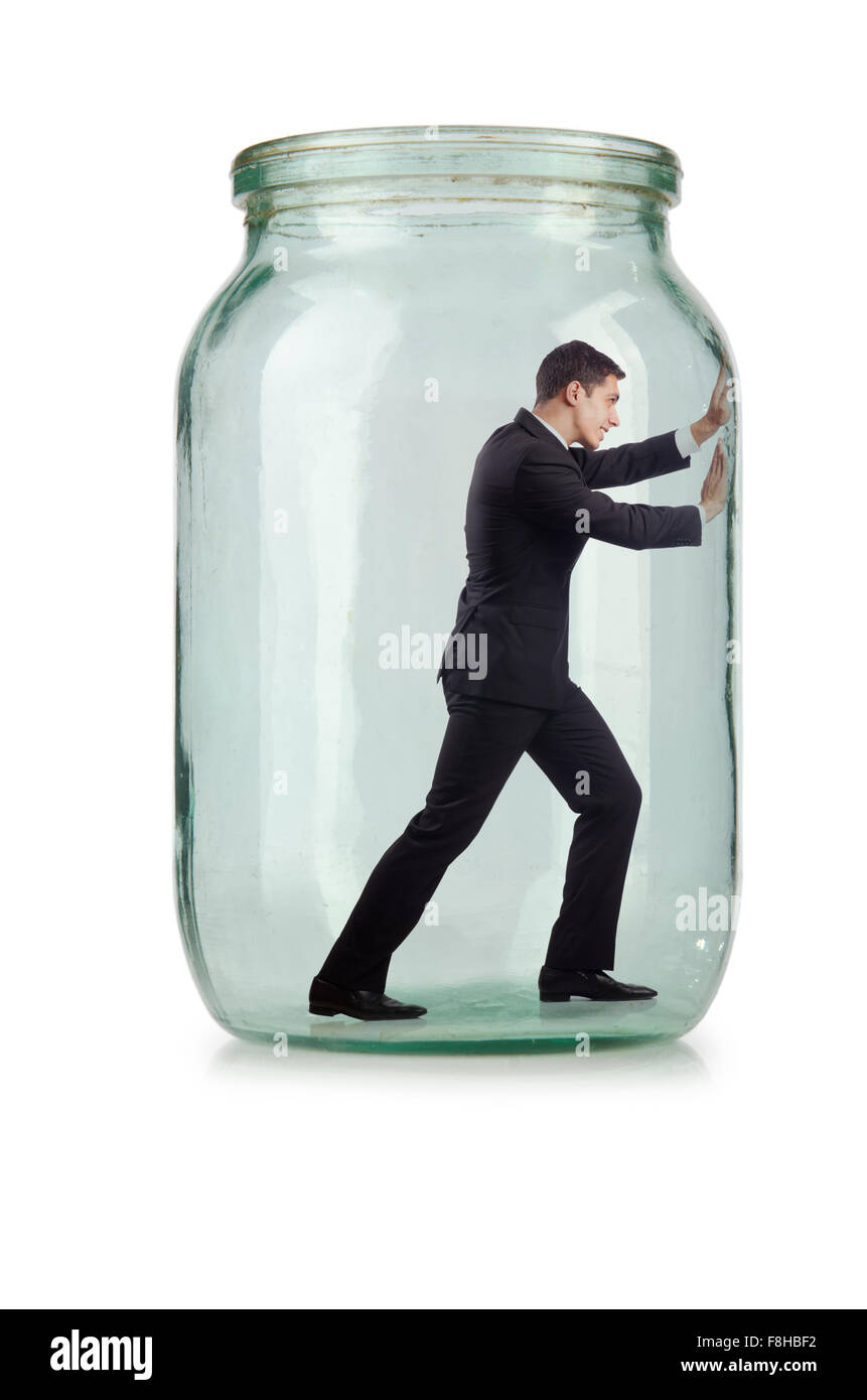 Young businessman in glass jar Stock Photo