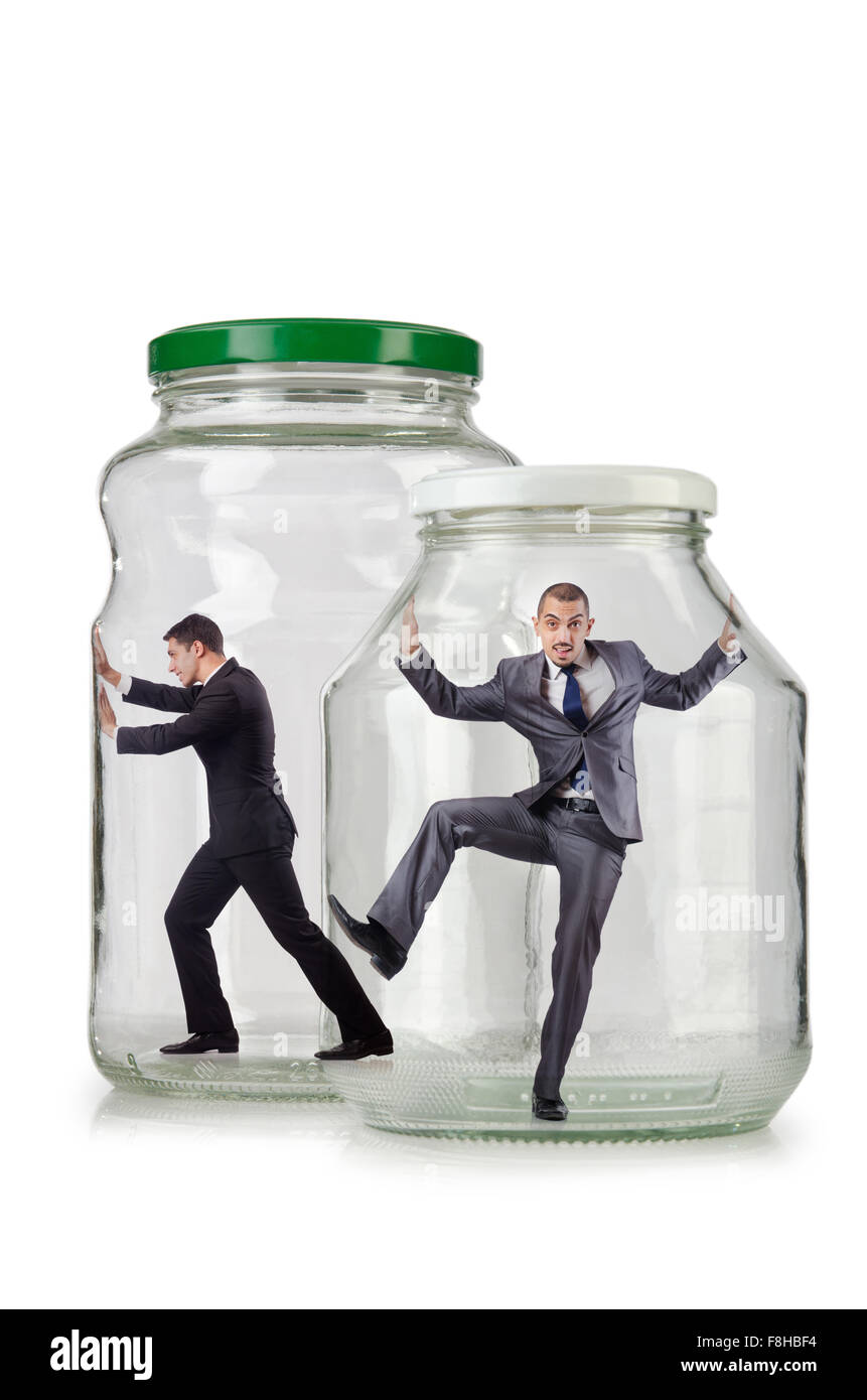 Young businessman in glass jar Stock Photo