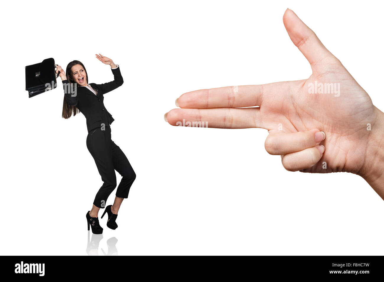 Hand threaten with gun gesture young woman Stock Photo
