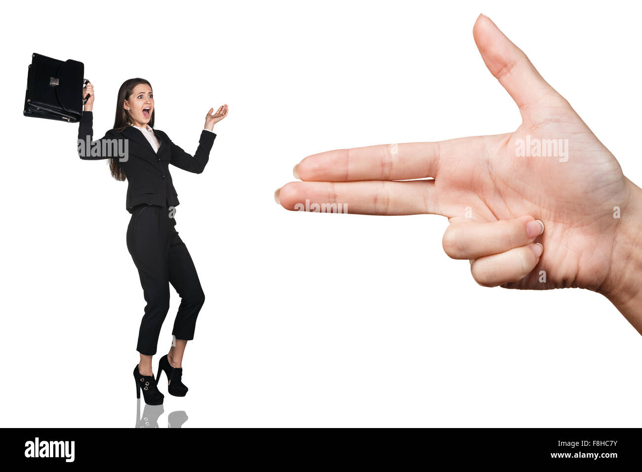 Hand threaten with gun gesture young woman Stock Photo