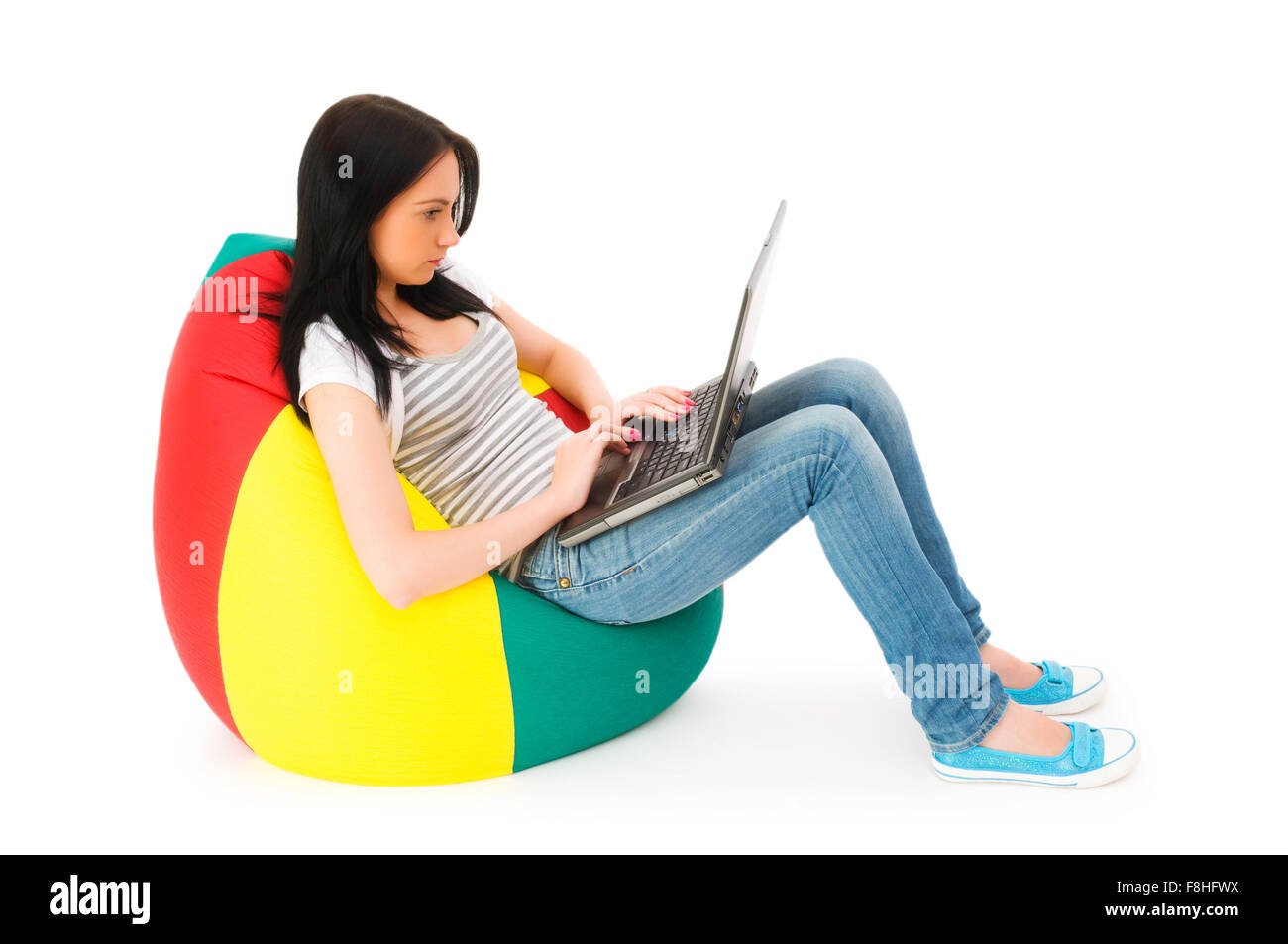 Girl working on laptop isolated on white Stock Photo - Alamy