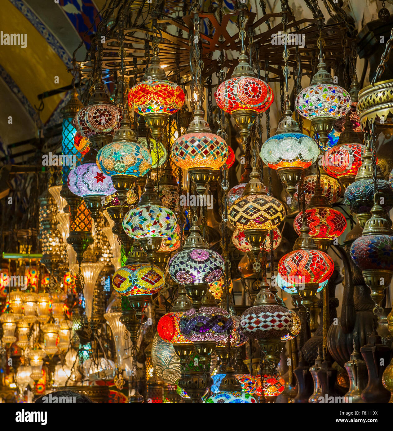 Ornate hanging glass lights at a stall in a market souk inside the grand bazaar Istanbul Turkey Stock Photo
