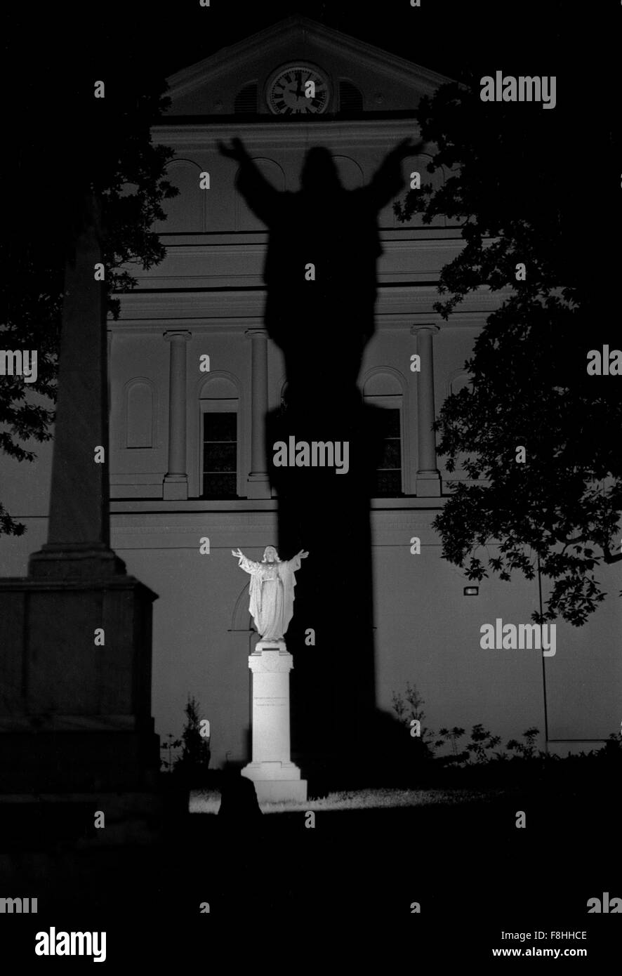 New Orleans, USA. 1988 Shadow of Jesus across church wall Stock Photo