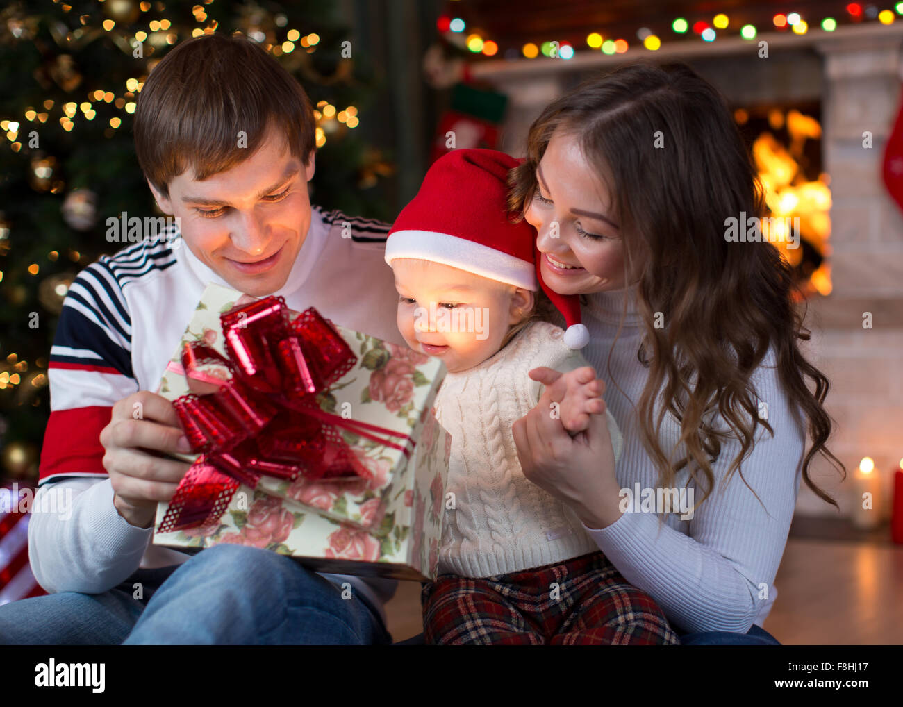 Opening gifts on Christmas and New Year Stock Photo