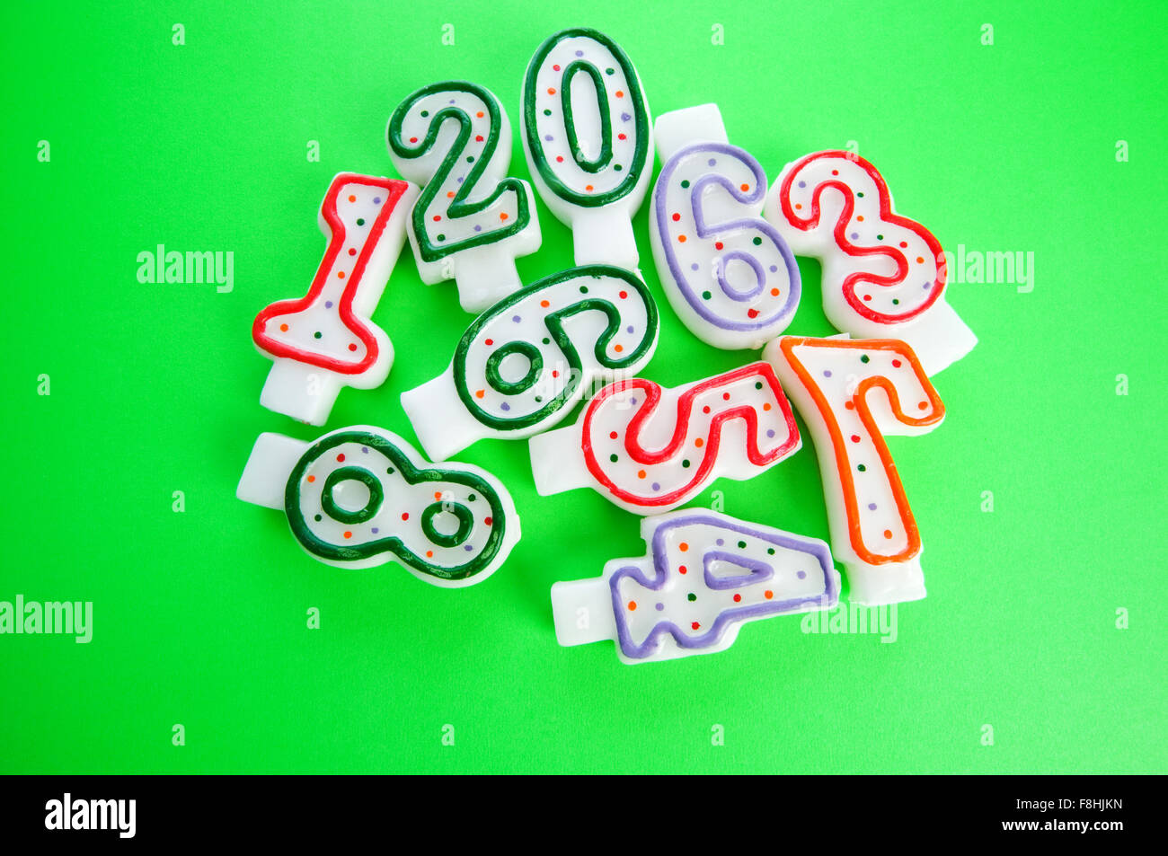Birthday candles against colourful background Stock Photo - Alamy