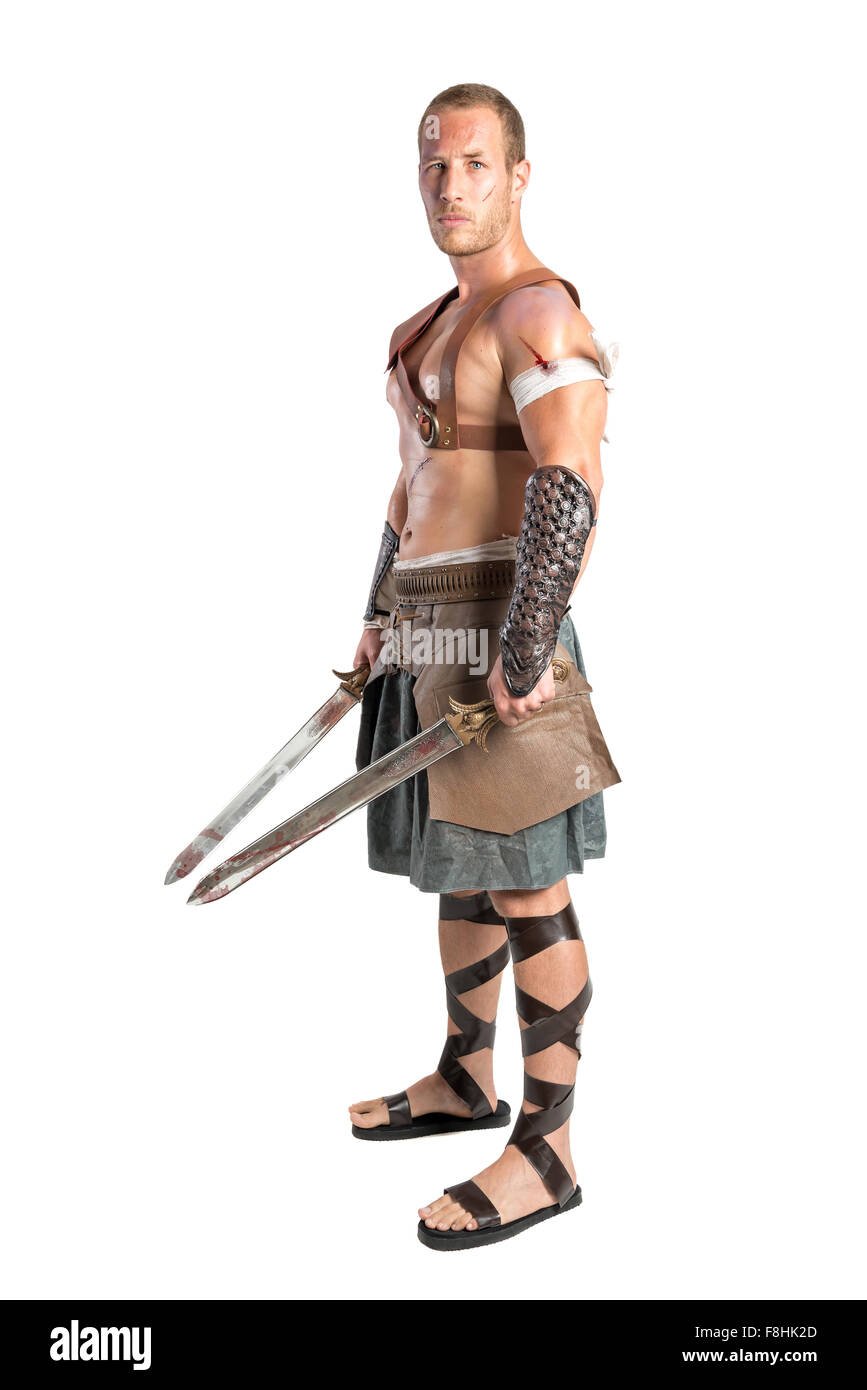 Gladiator posing isolated in a white background Stock Photo - Alamy