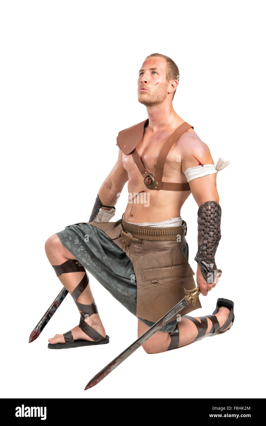 Gladiator posing isolated in a white background Stock Photo - Alamy