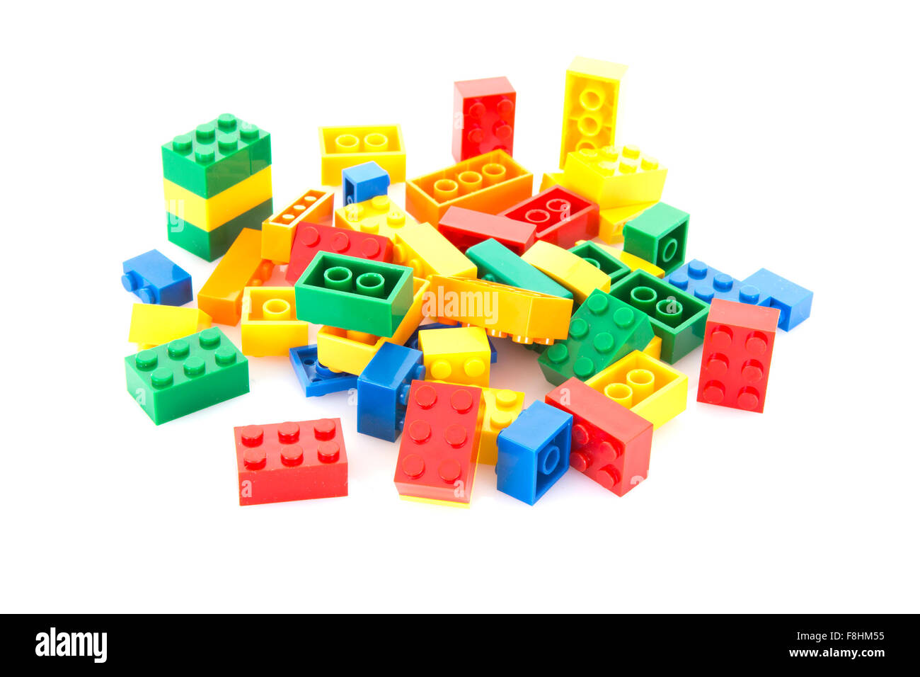 Colorful plastic building blocks on white background Stock Photo