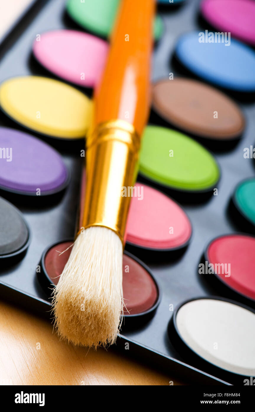 Art concept with painters palette and paint brush Stock Photo Alamy