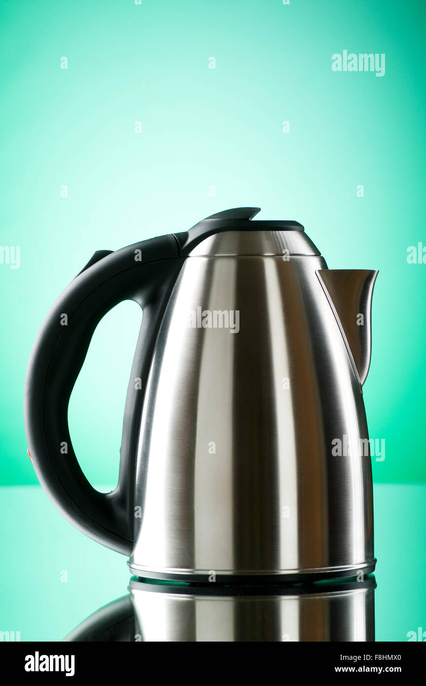 Shiny kettle against the colorful gradient background Stock Photo Alamy