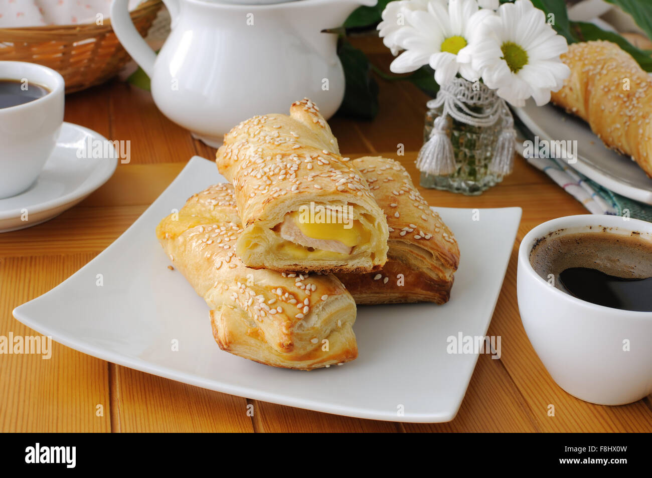 baked puff pastry with sesame, ham and cheese Stock Photo
