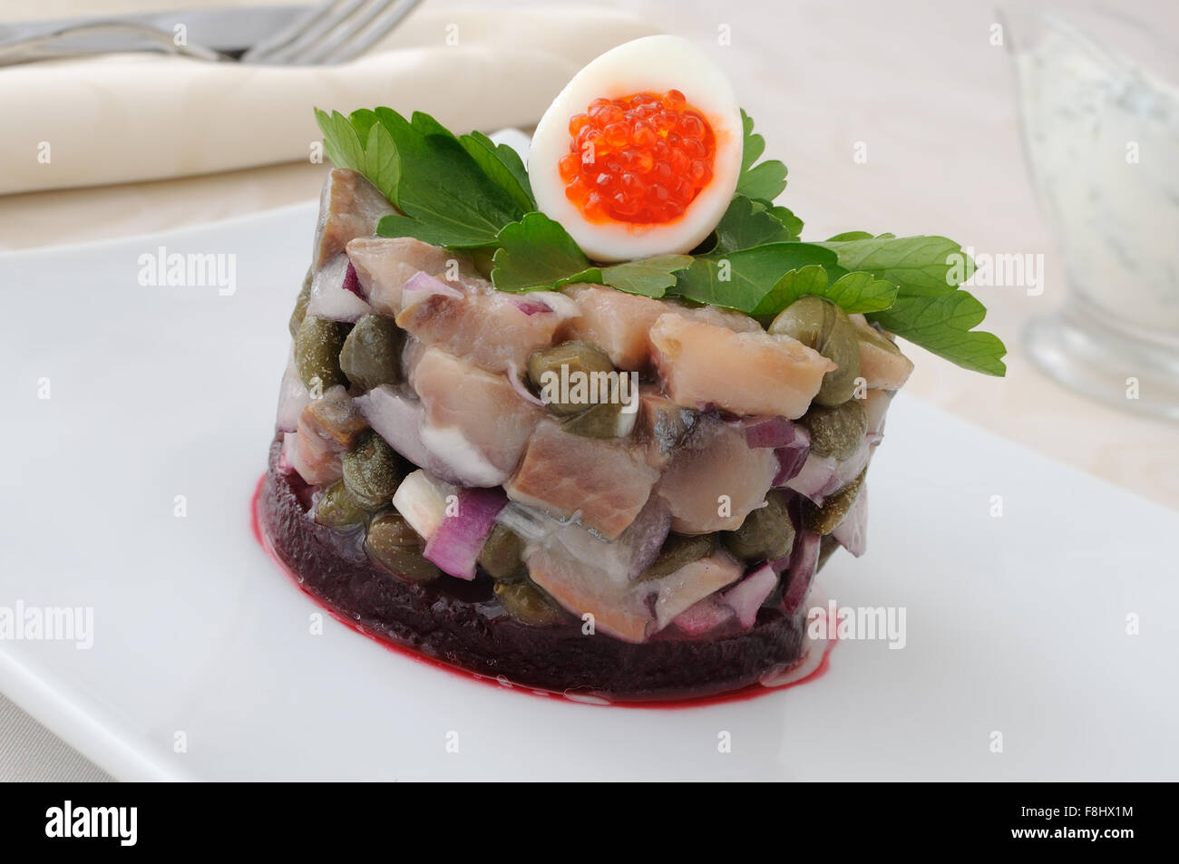 Herring tartare with capers and dill cream sauce Stock Photo