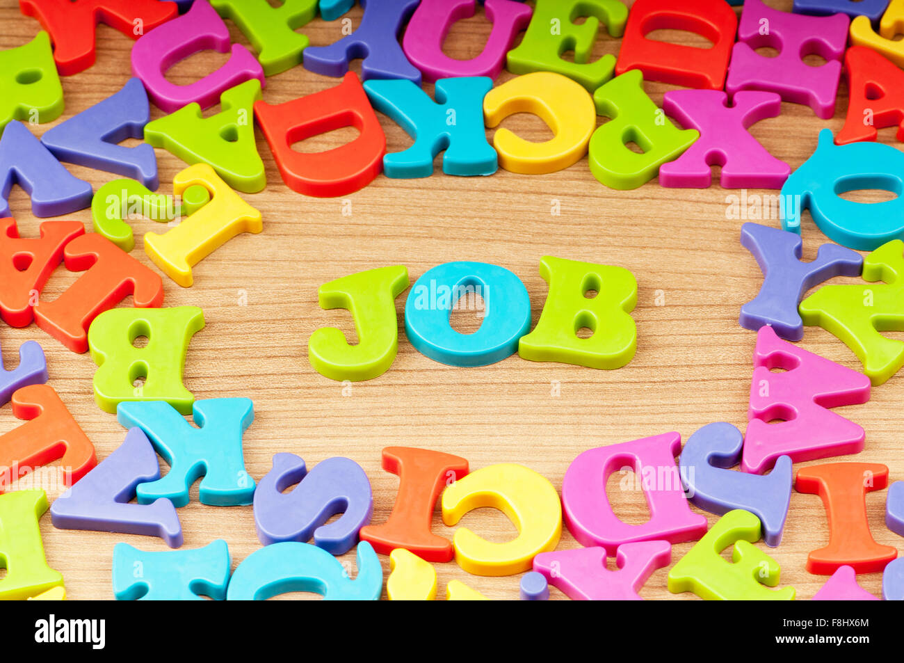 Employment concept with letters on background Stock Photo - Alamy