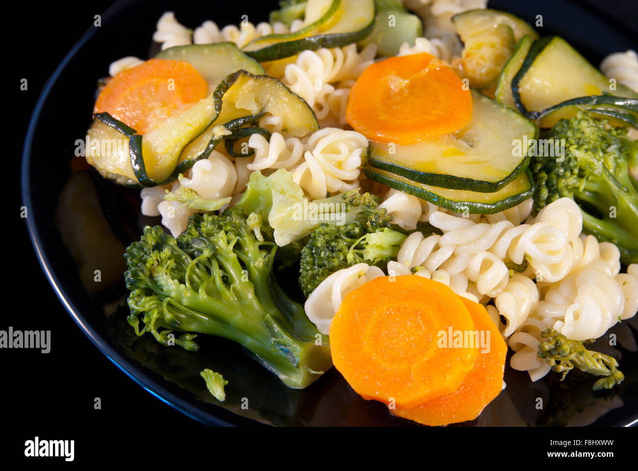 Italian pasta girandole with broccoli, zucchini and carrot Stock Photo