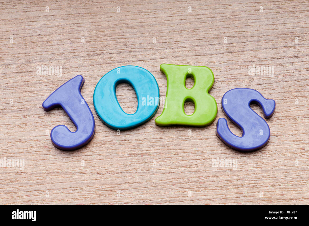 Employment concept with letters on background Stock Photo - Alamy
